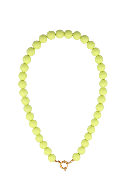 Single strand necklace with glossy navy blue resin beads and gold spring ring clasp on white background