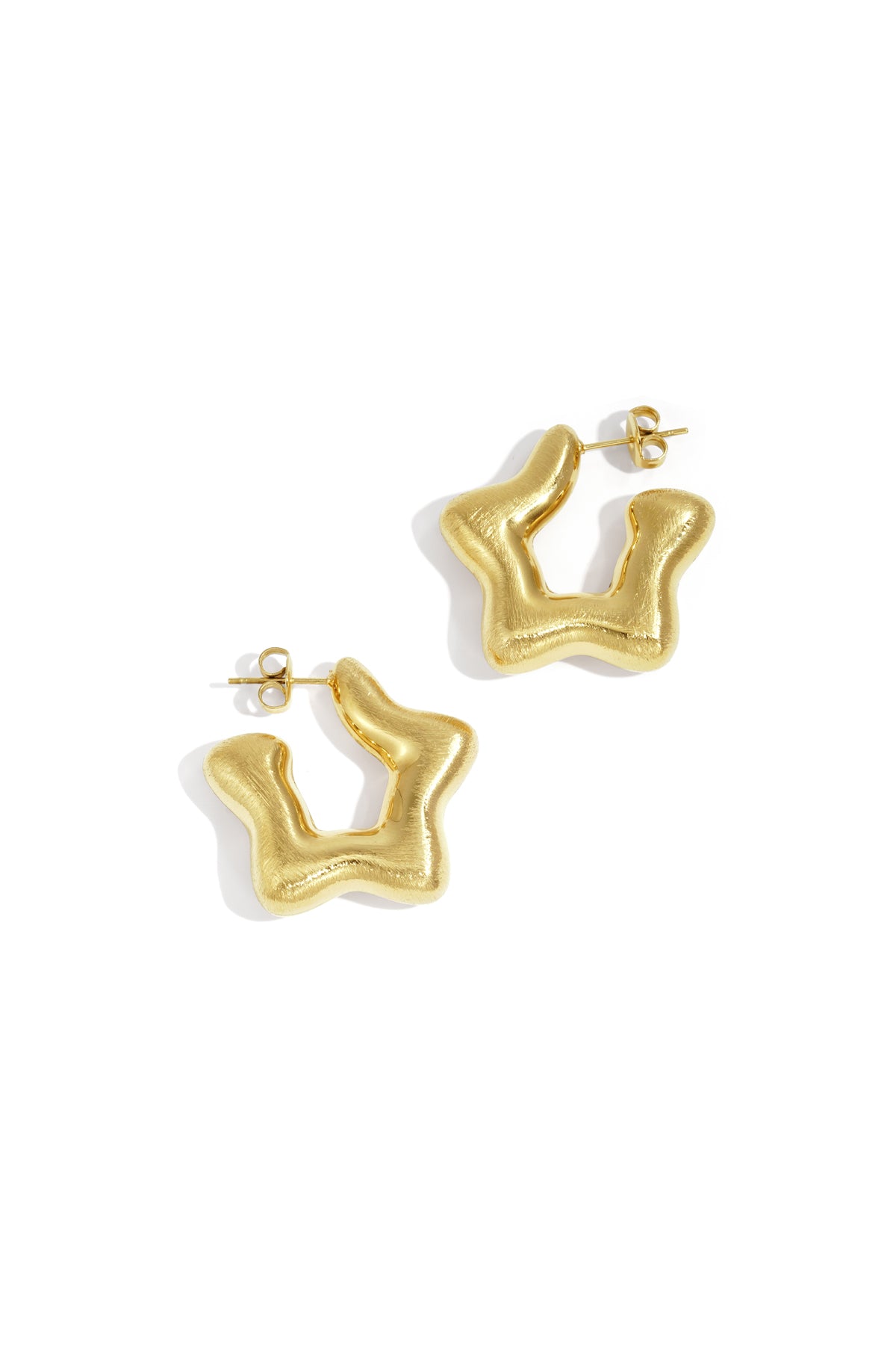 Pair of gold modern sculptural hoop earrings with a smooth, wavy abstract shape displayed on white background