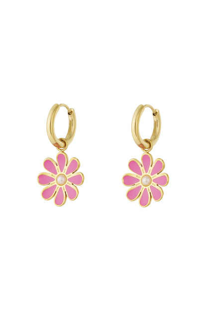 Pair of gold hoop earrings with pink enamel flower charms and pearl center on white background