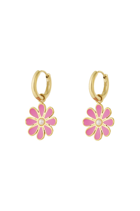 Pair of gold hoop earrings with pink enamel flower charms and pearl center on white background