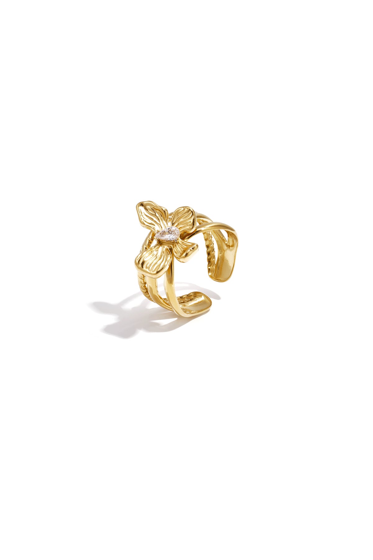 Gold flower accent adjustable statement ring with rhinestone center and layered petals on white background