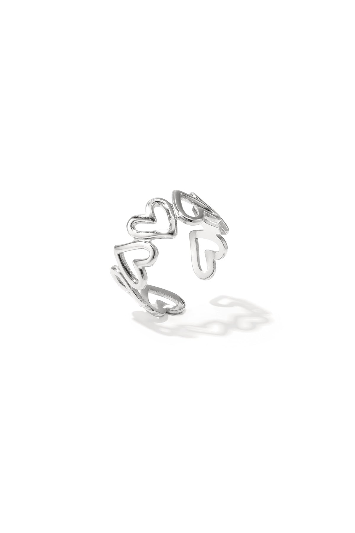 Silver open heart minimalist ring with linked hollow heart shapes on white background