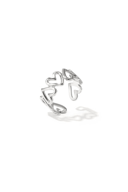 Silver open heart minimalist ring with linked hollow heart shapes on white background