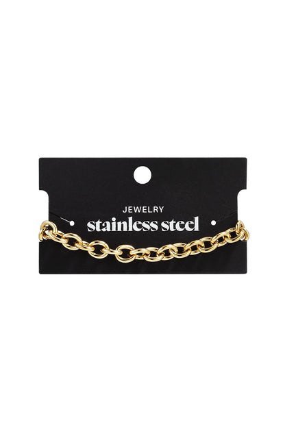 Gold-tone stainless steel bold link chain bracelet on a black display card.