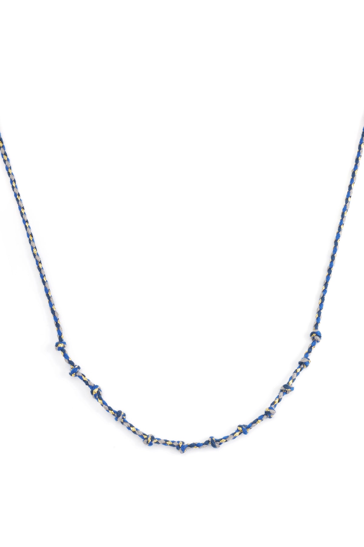 Blue knotted cotton necklace with gold accents laid flat on white background
