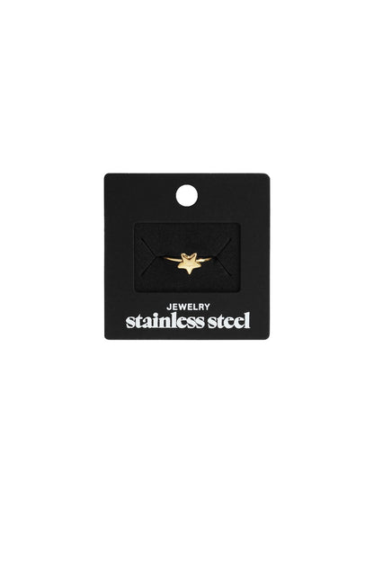 Gold stainless steel ring featuring a small, minimalist star charm on a black display card.