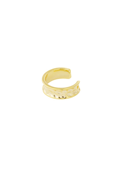 Single close-up image of a gold hammered metal ear cuff on a white background
