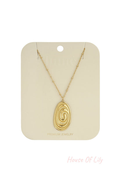 Gold-tone Irregular Soul necklace featuring an oval pendant with a swirling, textured design on a beaded chain.