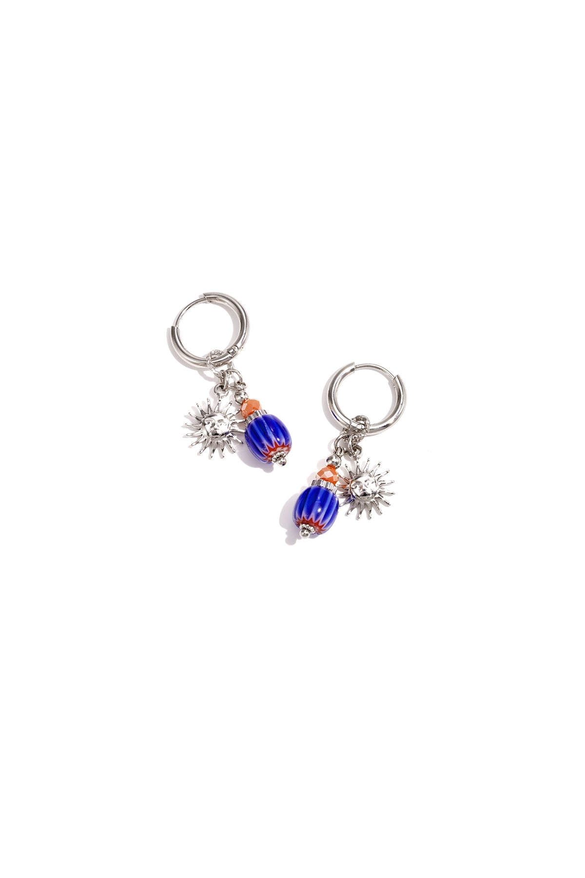 Silver tone hoop earrings featuring sun charms and blue-orange glass beads on white background