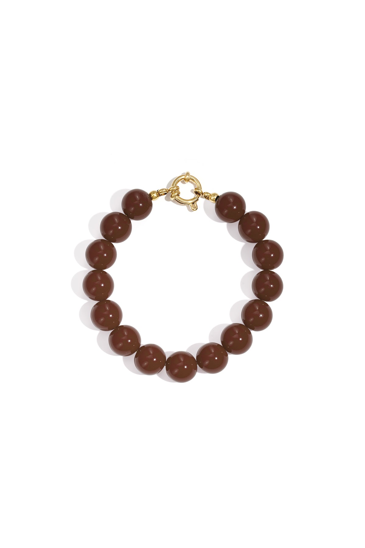 Bracelet of glossy, dark brown spherical resin beads with a gold-tone circular clasp on a white background.