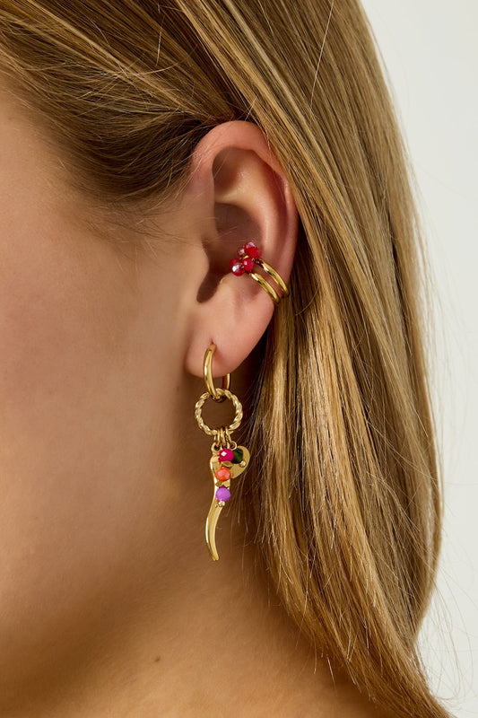 Model wearing red faceted bead floral ear cuff on the upper ear with matching gold hoop earring