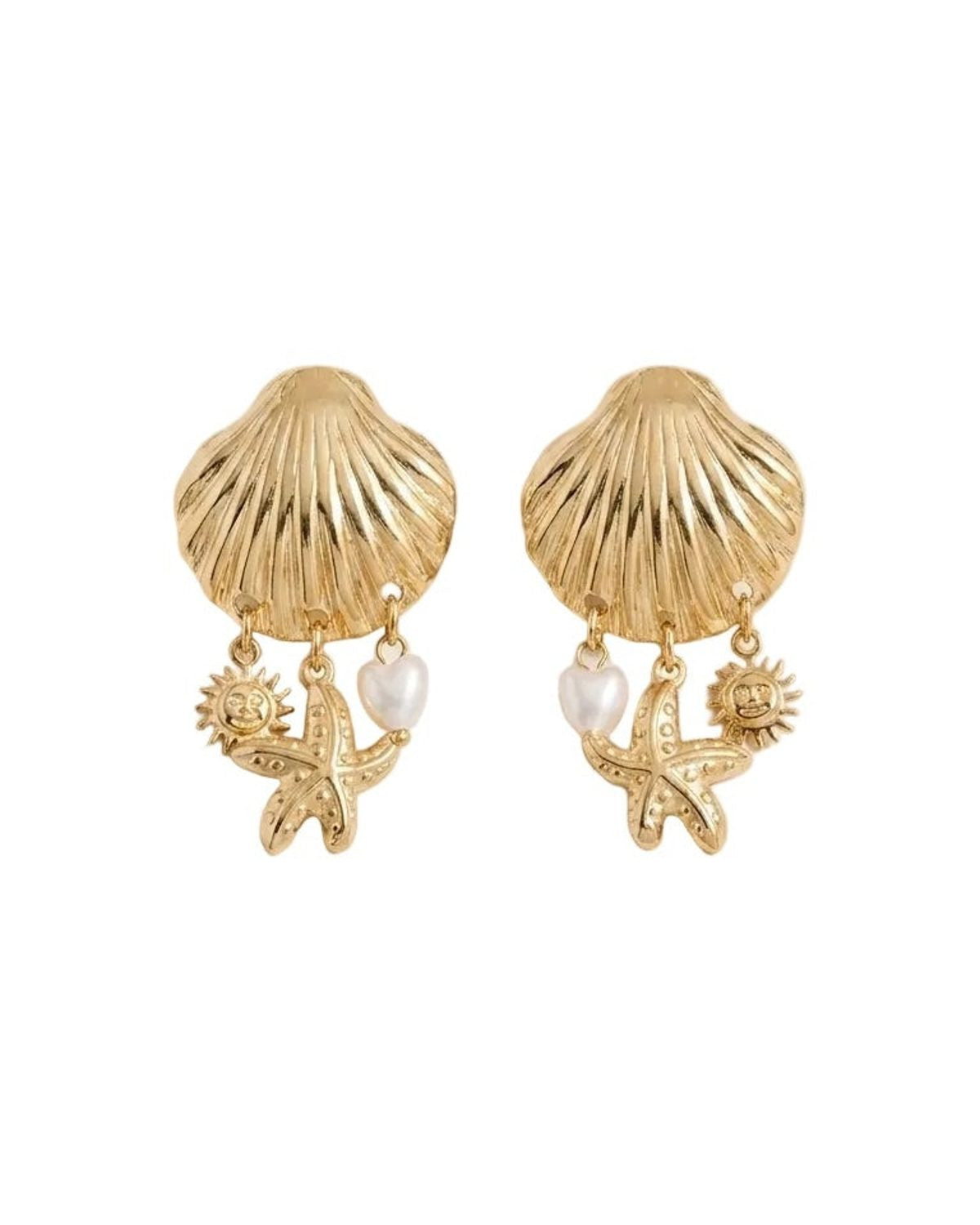 A pair of gold-toned shell-shaped earrings with dangling starfish, sun, and pearl charms, displayed on a light beige background.