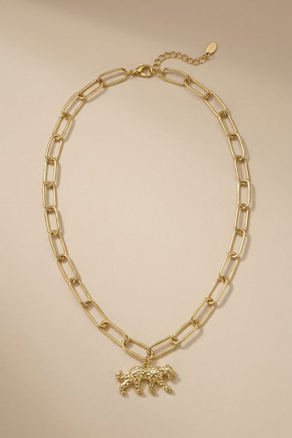 Gold-tone link chain necklace featuring a textured leopard pendant.