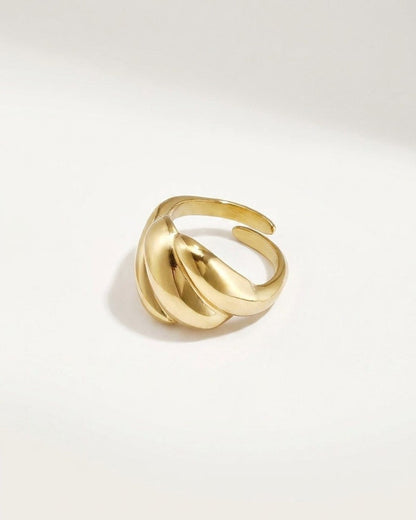 Polished gold-tone statement ring with a chunky, rounded, multi-band dome design and open back.