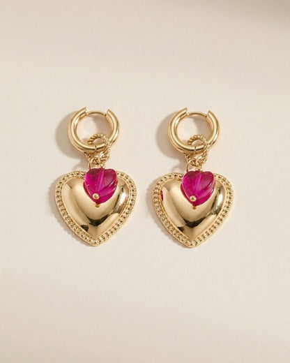Gold hoop earrings with beaded trim hearts and smaller pink crystal hearts suspended below.