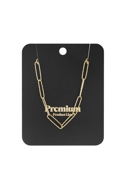 Gold-tone paperclip chain necklace with a textured, elongated link design displayed on a black card.