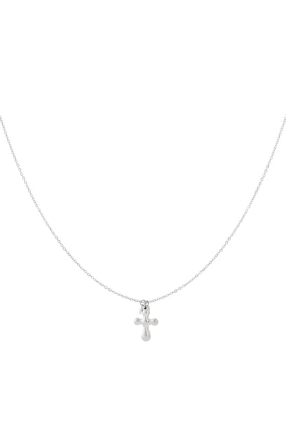 Minimal silver cross pendant necklace with thin chain on white background