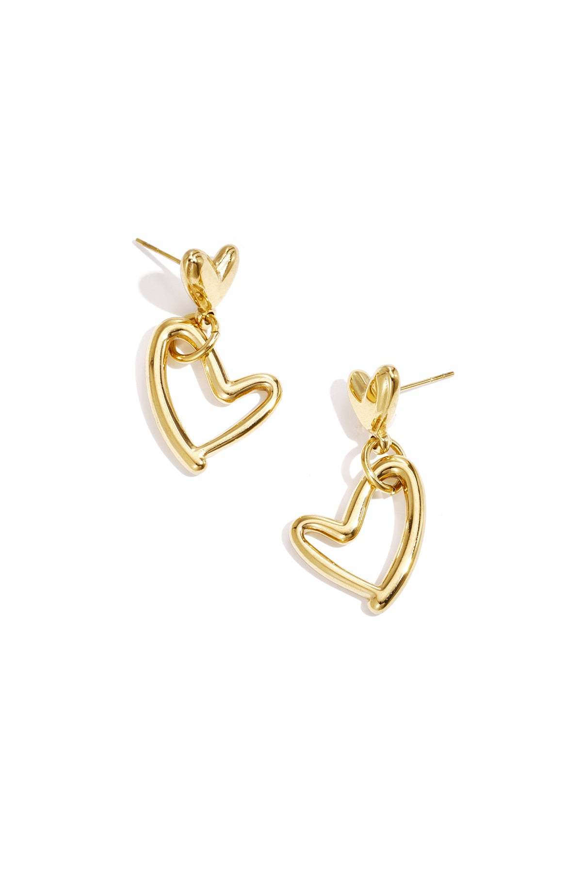 Pair of gold-tone heart-shaped drop earrings with small solid heart studs and larger open heart charms on a white background