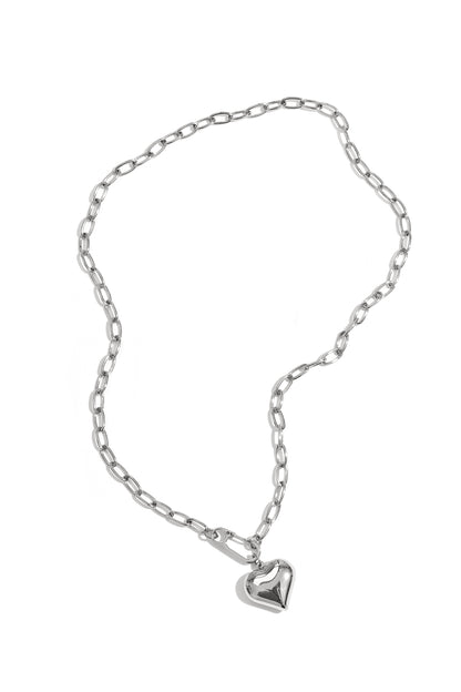 Silver chunky chain necklace with puff heart pendant displayed flat on white background
