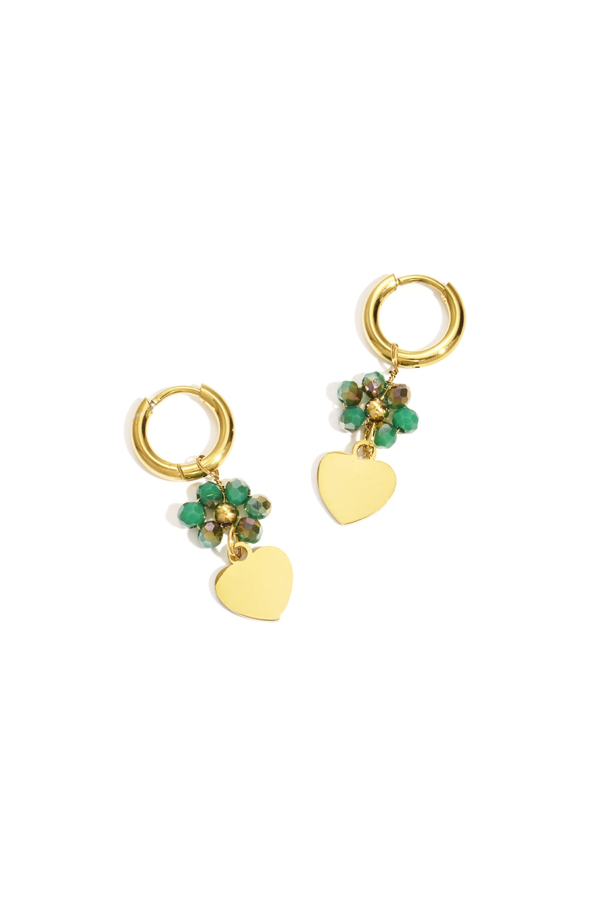 Pair of gold-tone hoop earrings with green faceted beads and dangling gold heart charms on white background