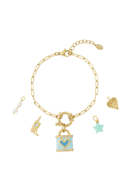 Gold charm bracelet with light blue heart lock, pearl beads, star, boot and textured heart charms displayed detached