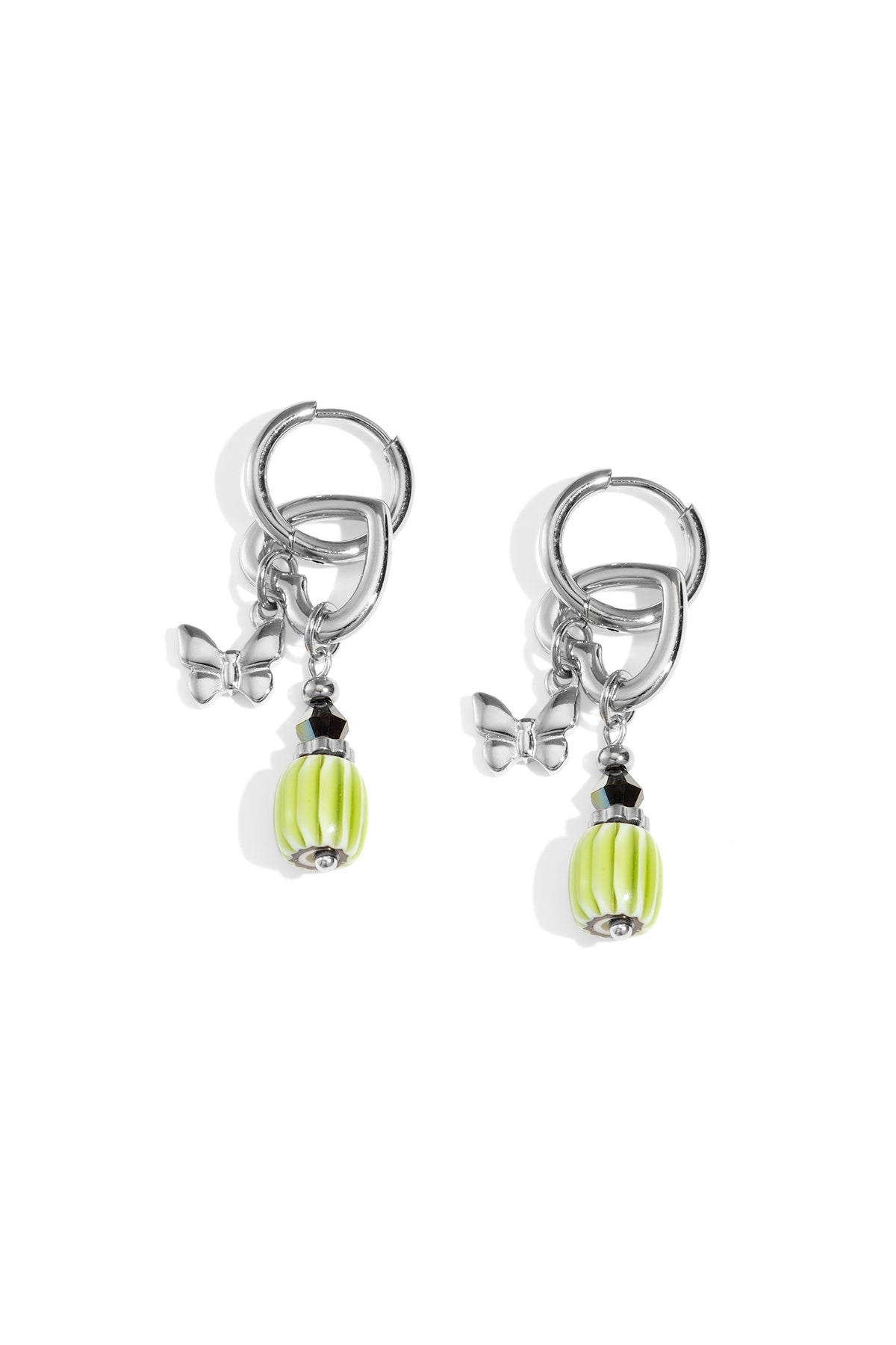 Pair of silver-tone butterfly charm drop earrings with green ribbed beads and black accent beads on white background