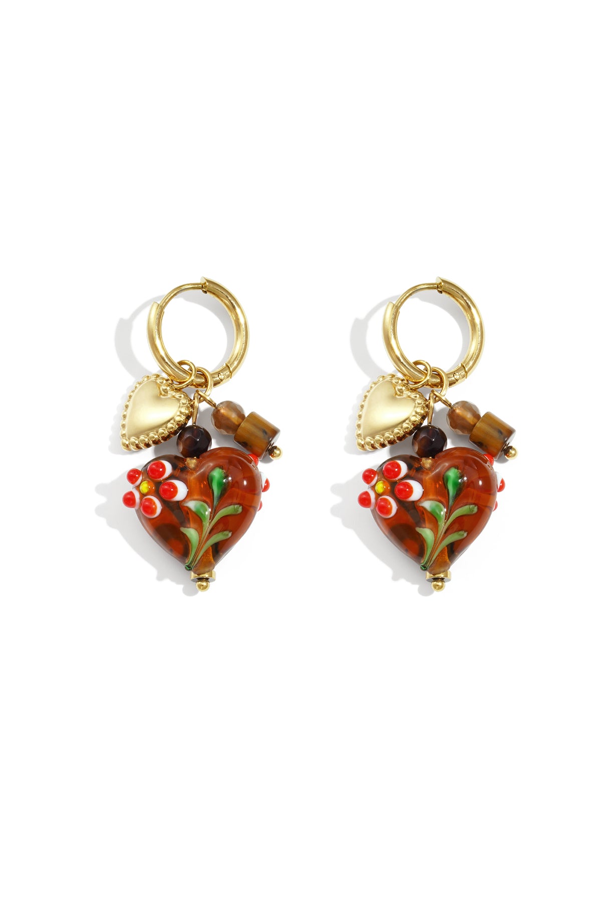 Pair of gold hoop earrings with brown glass heart charms decorated with red and white flowers and gold heart pendants