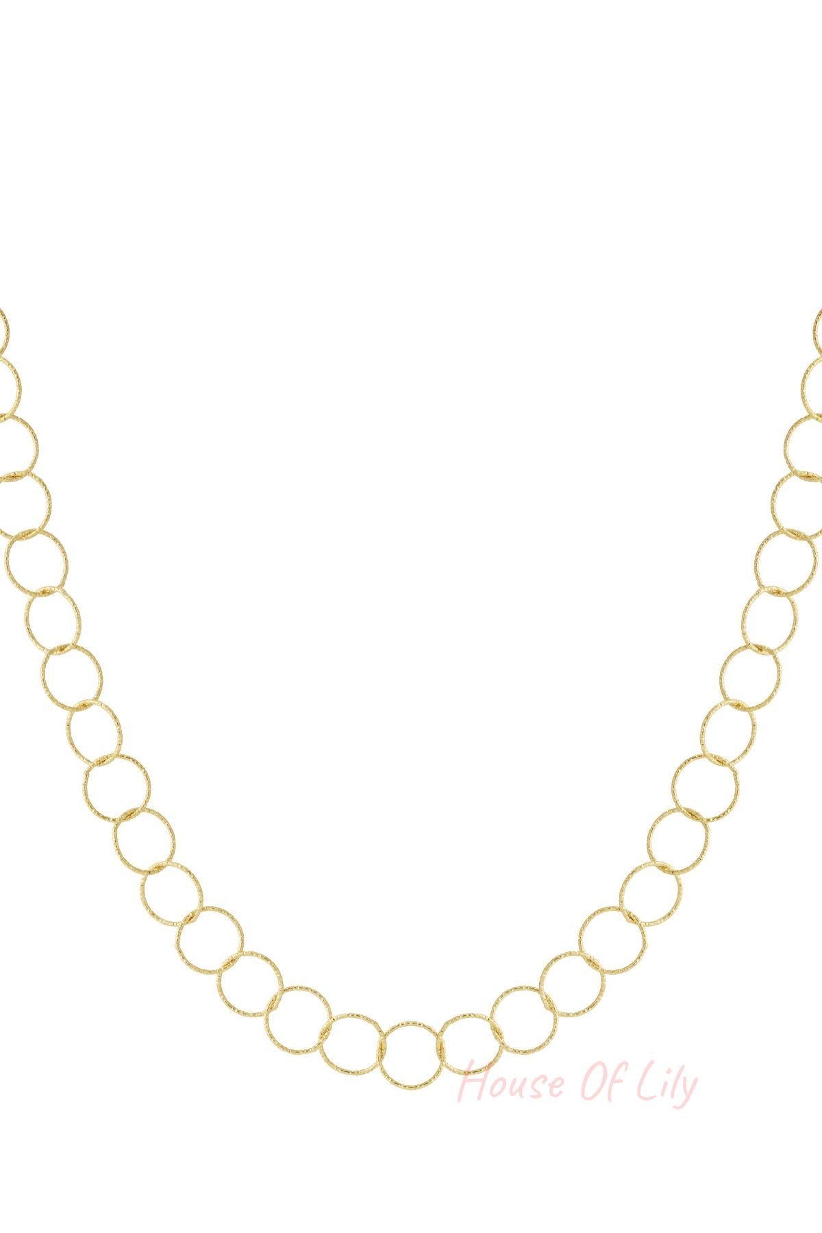 Close-up of textured loop chain necklace in gold tone on white background