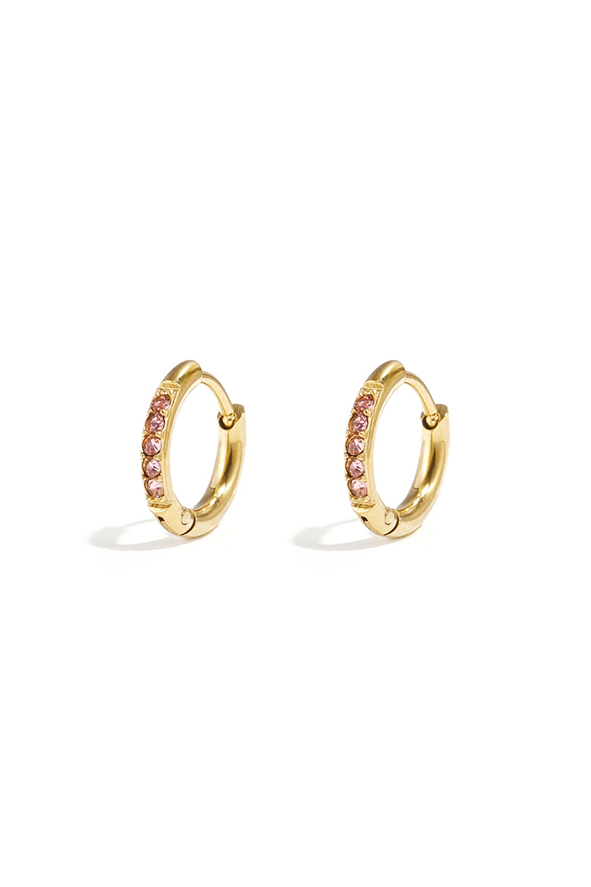 Pair of small gold hoop earrings with pink rhinestones on a white background