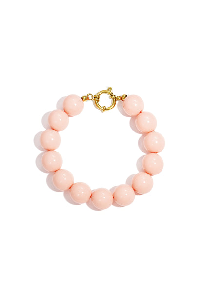 Peach chunky beaded bracelet with shiny resin beads and front gold clasp