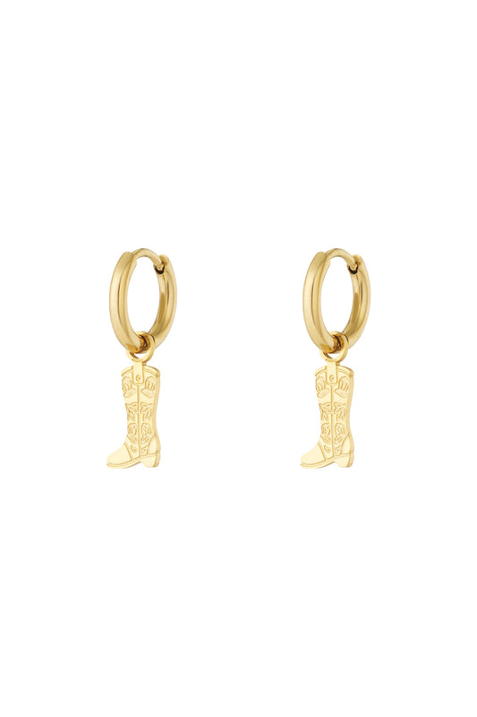 Pair of gold hoop earrings with hanging cowboy boot charms featuring floral detail on white background
