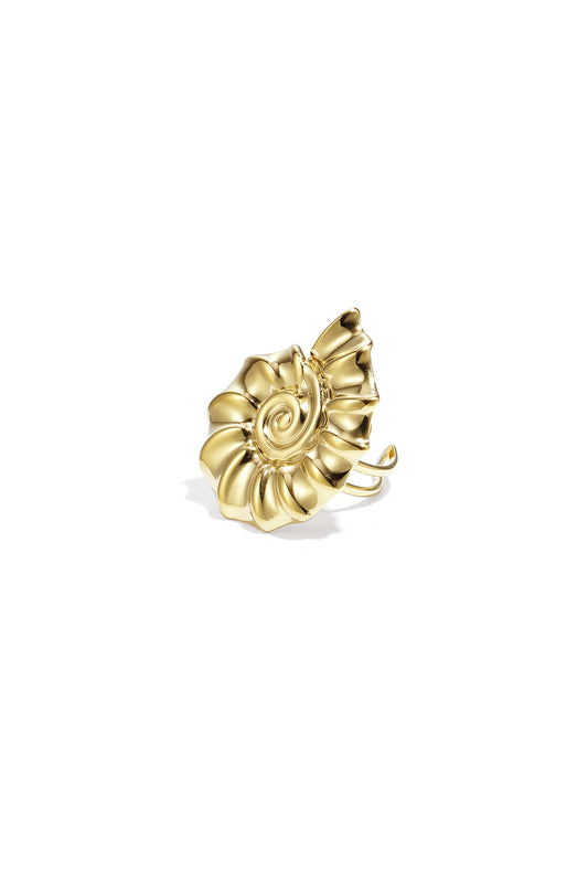 Close-up of gold spiral shell shaped statement ring on white background