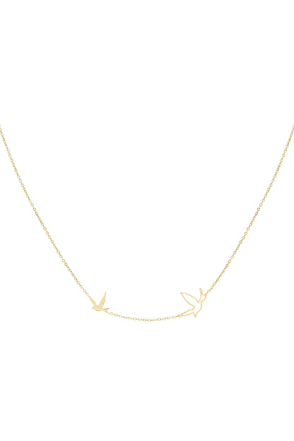 Close-up of a delicate gold necklace featuring two bird-shaped charms on a fine chain