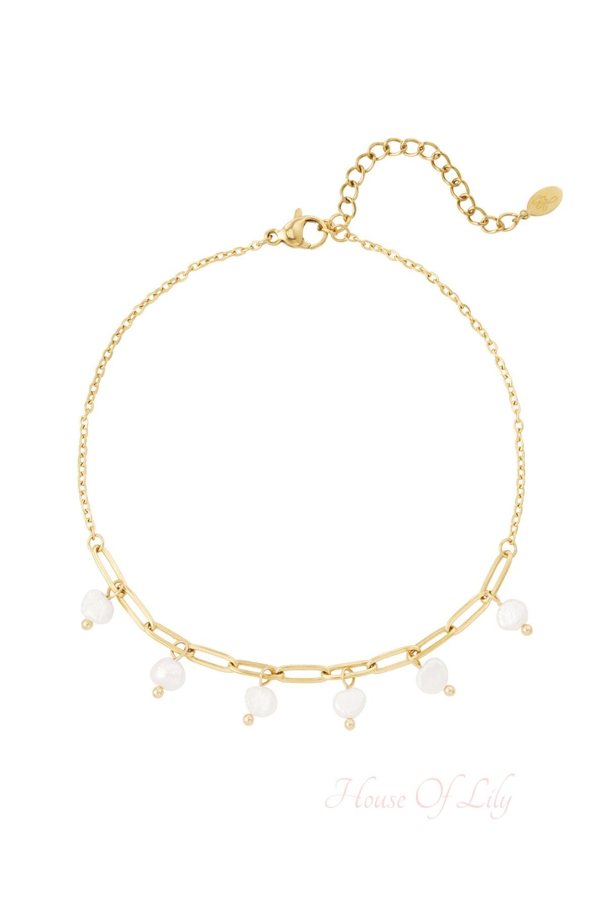 Close-up of a gold chain anklet with six white pearl charms and an adjustable clasp on a white background