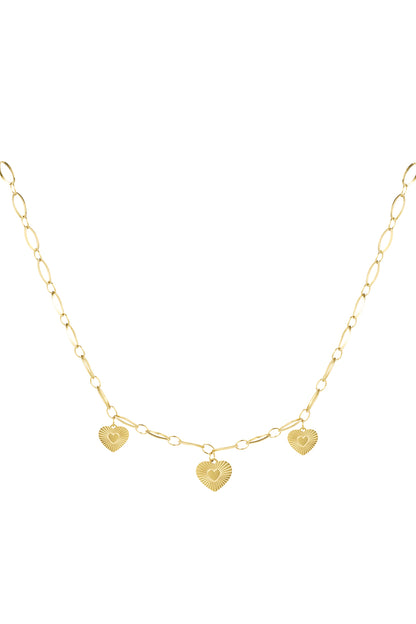 Gold triple heart charm necklace with sunburst textured pendants on a linked chain