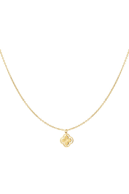 Gold delicate clover pendant necklace on white background