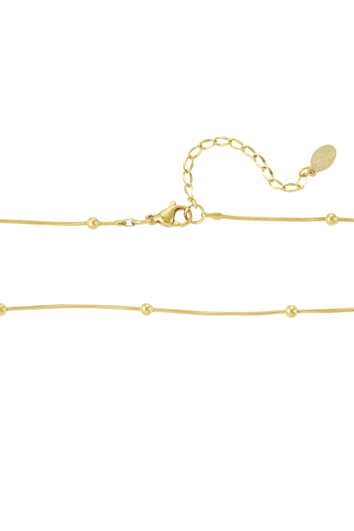 Detailed view of the gold necklace clasp with an adjustable extension chain and signature brand tag