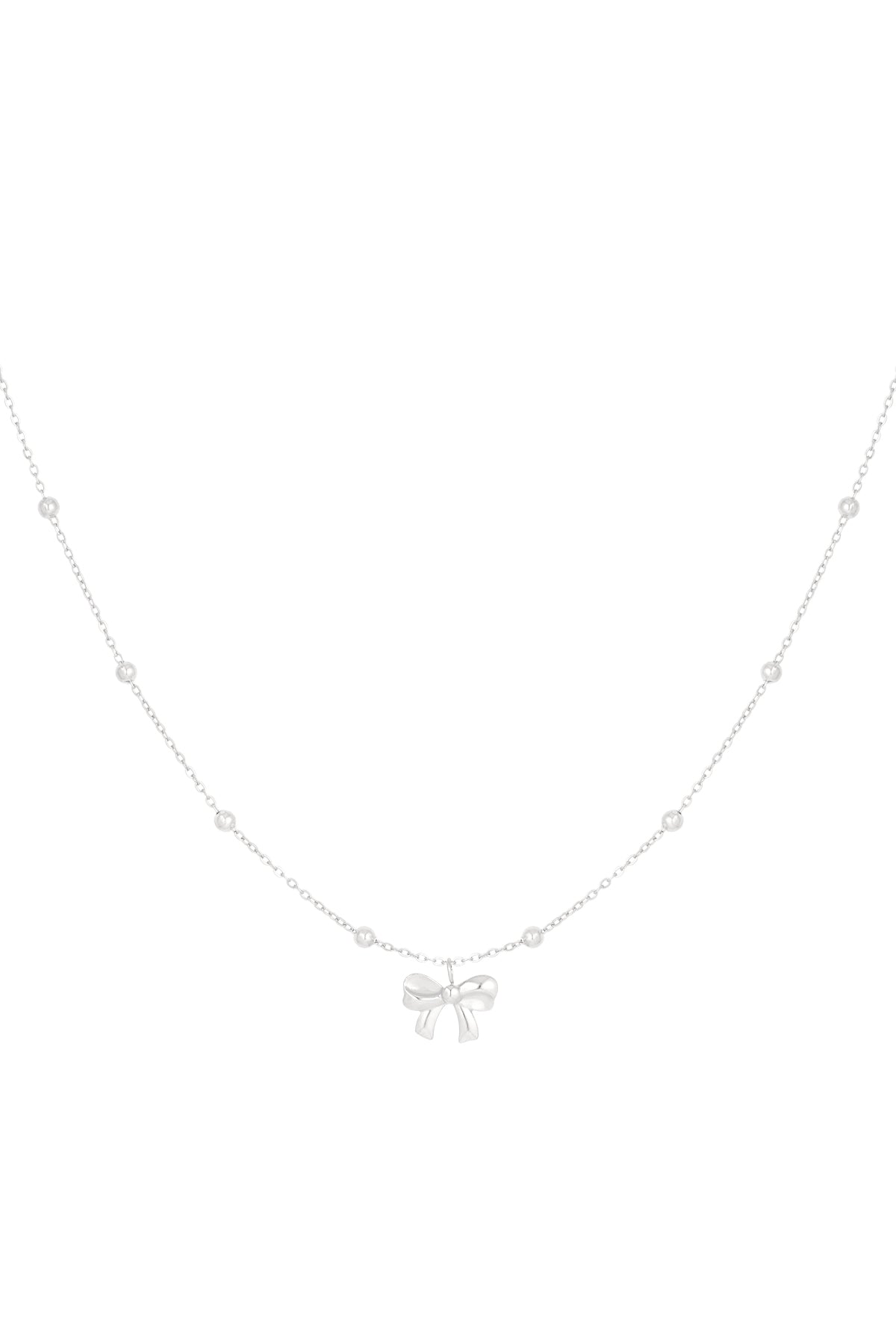Silver delicate chain necklace with small round beads and a central bow pendant on a white background