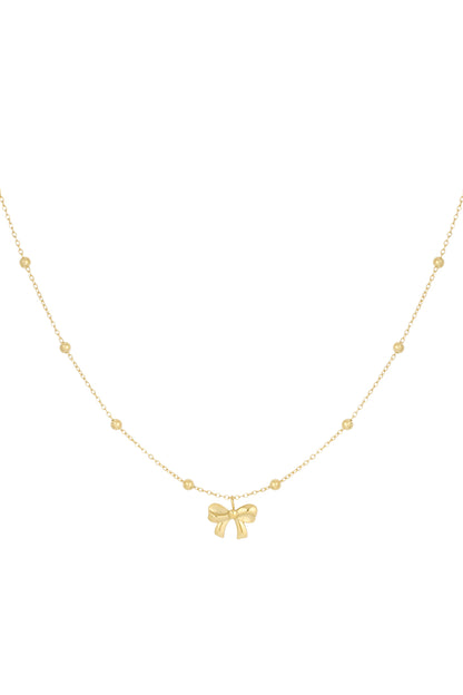 Gold delicate chain necklace with small round beads and a central bow pendant on a white background