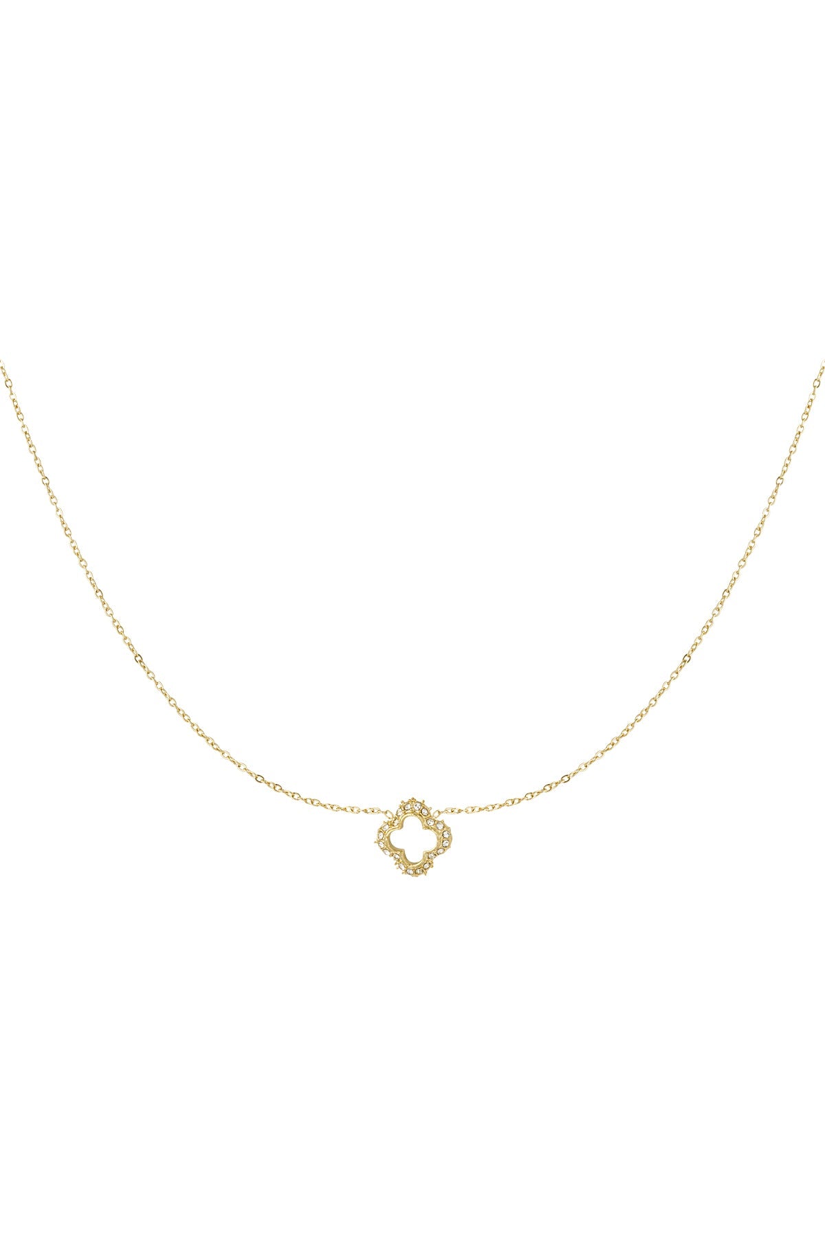Close-up of delicate gold clover pendant necklace adorned with small rhinestones on fine chain