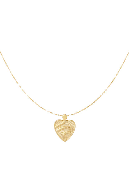 Gold textured heart pendant necklace on white background showing delicate chain and unique wave design