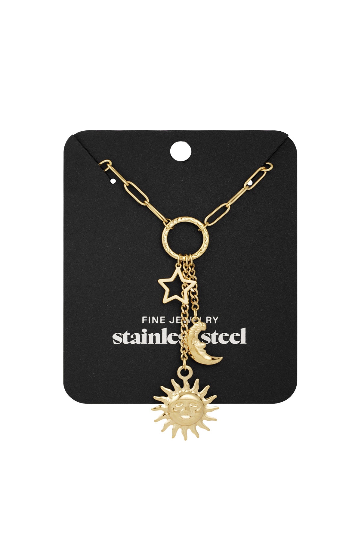 Gold-tone celestial charm necklace with sun, moon and star pendants displayed on black packaging card labelled 'stainless steel fine jewelry'
