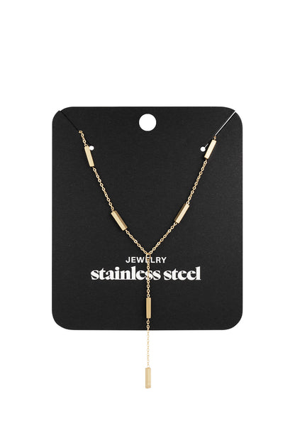Gold-tone modern bar pendant necklace displayed on black packaging card with 'stainless steel' text