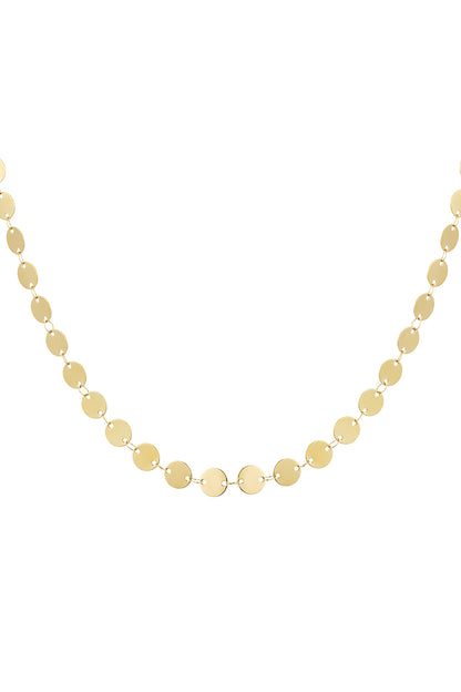 Close-up image of a gold-toned dainty disc chain necklace with small round mirrors linked in a delicate chain.