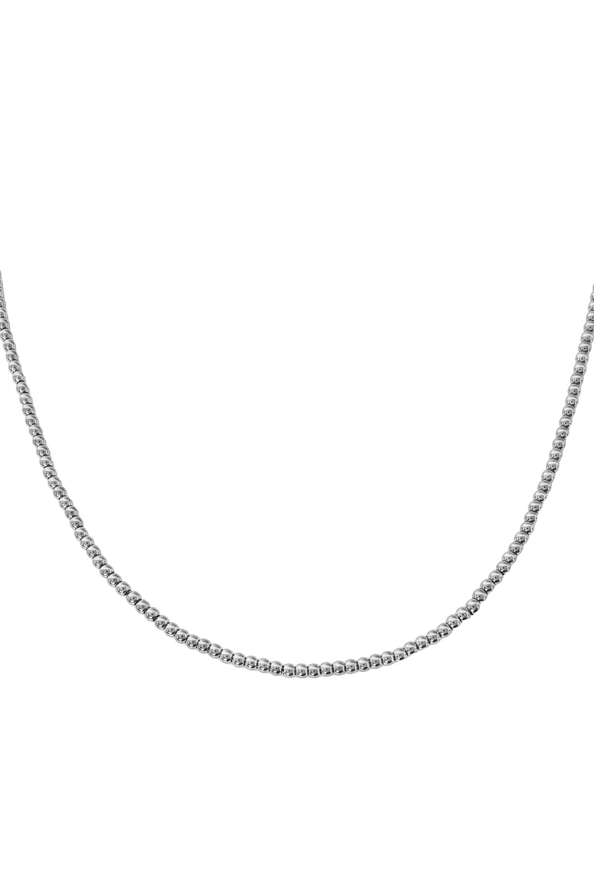 Close-up of silver-toned beaded necklace with uniform round beads against white background