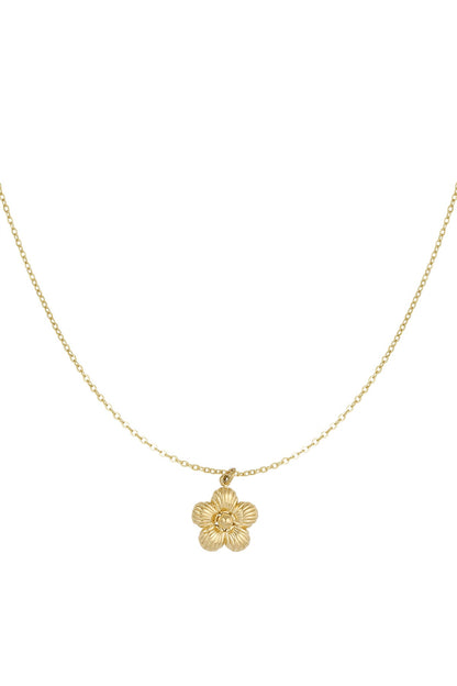 Gold flower pendant necklace with delicate chain on white background