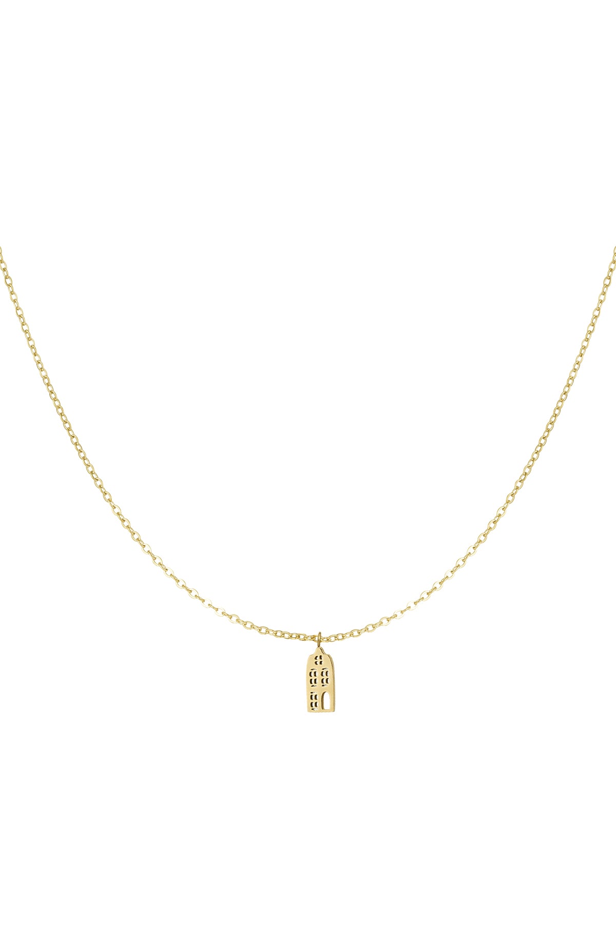 Close-up of delicate gold necklace featuring a small cityscape pendant on a fine chain