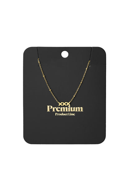 Gold XXX pendant necklace displayed on black card reading Premium Product Line