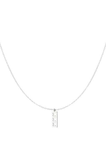 Silver minimalist necklace with a rectangular pendant featuring three cut-out X shapes, displayed on a white background.
