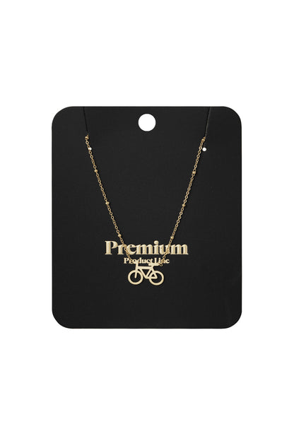 Gold cycle chic pendant necklace displayed on black premium product card